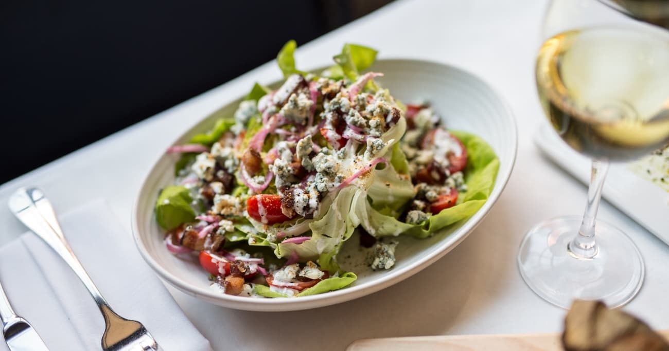 Plate a salad and glass of wine